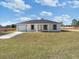 Charming single-story home featuring a well-manicured lawn and attached garage at 2746 Sw 147Th Ct, Ocala, FL 34481