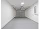 Clean two car garage with coated floor and white walls at 2746 Sw 147Th Ct, Ocala, FL 34481