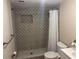 This bathroom features a beautifully tiled shower with glass doors, toilet and vanity at 400 Sw 1St Ave, Mulberry, FL 33860