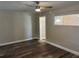 Comfortable bedroom with wood-look flooring, neutral paint, and bright natural light at 400 Sw 1St Ave, Mulberry, FL 33860