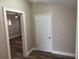 Hallway with wood-look floors and natural lighting at 400 Sw 1St Ave, Mulberry, FL 33860