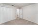The bedroom includes neutral carpet, white trim, and a closet with traditional doors at 1313 Periwinkle Ct, Lakeland, FL 33811