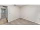This bedroom features carpet and a doorway leading to another room in the home at 1313 Periwinkle Ct, Lakeland, FL 33811