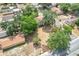 Aerial view of the property surrounded by trees in a suburban neighborhood at 713 W 3Rd St, Lakeland, FL 33805