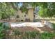 View of the back of the house with a large concrete pad and storage shed at 713 W 3Rd St, Lakeland, FL 33805