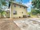 Expansive backyard featuring a concrete pad and lush landscaping at 713 W 3Rd St, Lakeland, FL 33805
