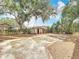 Large backyard with a utility shed, mature trees, and plenty of space to play at 713 W 3Rd St, Lakeland, FL 33805