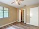 Bedroom with laminate flooring, closet, neutral paint, and natural light from a window at 713 W 3Rd St, Lakeland, FL 33805
