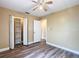 Bedroom featuring modern ceiling fan, laminate flooring, neutral paint, closet and windows at 713 W 3Rd St, Lakeland, FL 33805