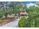 Charming exterior view of a two-story home with a welcoming front porch at 713 W 3Rd St, Lakeland, FL 33805