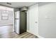 Kitchen with stainless steel refrigerator, access to additional room, and neutral wall color at 713 W 3Rd St, Lakeland, FL 33805