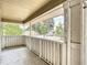 Inviting front porch with white wood railing overlooking the neighborhood street at 713 W 3Rd St, Lakeland, FL 33805