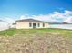 Large backyard with a charming white fence, offering privacy and space for recreation at 1639 Saddlehorn Dr, Lakeland, FL 33810