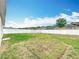 Spacious backyard with green grass and a clean white fence, offering privacy at 1639 Saddlehorn Dr, Lakeland, FL 33810