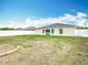 Expansive backyard featuring a well-maintained lawn, white fence, and room for outdoor activities at 1639 Saddlehorn Dr, Lakeland, FL 33810