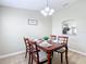 Inviting dining room with a wooden table set for four, complemented by a decorative 