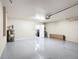 Spacious garage with epoxy flooring and extra room for storage or a workbench at 1639 Saddlehorn Dr, Lakeland, FL 33810