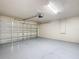 Bright and clean garage with smooth epoxy flooring and a modern garage door at 1639 Saddlehorn Dr, Lakeland, FL 33810
