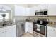 Stylish kitchen with stainless steel appliances, granite countertops, and ample cabinet space at 1639 Saddlehorn Dr, Lakeland, FL 33810