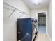 Convenient laundry room with modern washer/dryer, shelving, and easy access to the garage at 1639 Saddlehorn Dr, Lakeland, FL 33810