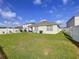 Lush green lawn and an enclosed backyard with white vinyl fencing at 3205 Royal Tern Dr, Winter Haven, FL 33881