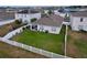 Spacious fenced backyard with a well-manicured lawn, a covered patio, and ample room for outdoor entertaining and recreation at 3205 Royal Tern Dr, Winter Haven, FL 33881