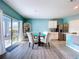Dining area with outdoor access, stylish furniture and open access to the kitchen at 3205 Royal Tern Dr, Winter Haven, FL 33881