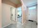 Inviting entryway with tile flooring and views into the bathroom and living room at 3205 Royal Tern Dr, Winter Haven, FL 33881
