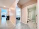 Hallway with views to bathroom and bedroom with tile flooring at 3205 Royal Tern Dr, Winter Haven, FL 33881