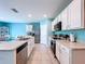 Bright kitchen with stainless appliances, breakfast bar, and seamless flow into the dining area at 3205 Royal Tern Dr, Winter Haven, FL 33881