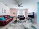 Bright living room boasts wood floors, comfortable seating, neutral walls, and stylish decor for a cozy atmosphere at 3205 Royal Tern Dr, Winter Haven, FL 33881
