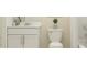 Clean bathroom featuring a white vanity, toilet, and shower/tub combination with modern fixtures at 2759 Pioneer Trl, Eagle Lake, FL 33839