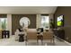 Well-lit living space featuring a comfortable sofa, stylish decor, and seamless kitchen view at 2763 Pioneer Trl, Eagle Lake, FL 33839