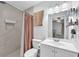 Bright bathroom with a tiled shower and modern vanity at 3360 Cross Fox Dr, Mulberry, FL 33860