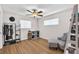 Bedroom with wood floors, a ceiling fan, and great natural light at 3360 Cross Fox Dr, Mulberry, FL 33860