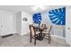 Cozy dining area showcasing a round table, decorative wall art, and modern pendant lighting at 3360 Cross Fox Dr, Mulberry, FL 33860