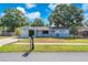 Charming single-story home featuring a well-manicured lawn and a cozy, inviting entryway at 3360 Cross Fox Dr, Mulberry, FL 33860