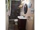 Bathroom featuring dark tile, vanity and decor at 11305 Sw 186Th Cir, Dunnellon, FL 34432