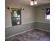 Bedroom with light green walls and stylish tile flooring at 11305 Sw 186Th Cir, Dunnellon, FL 34432