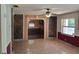 Spacious living room with tile flooring and a kitchen in the background at 11305 Sw 186Th Cir, Dunnellon, FL 34432