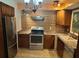 A practical kitchen equipped with stainless steel appliances and plenty of cabinet space at 11305 Sw 186Th Cir, Dunnellon, FL 34432
