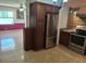 Well-equipped kitchen area featuring stainless steel refrigerator and traditional cabinetry at 11305 Sw 186Th Cir, Dunnellon, FL 34432