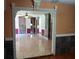 Open living space with tile flooring, ceiling fan, and view of the kitchen at 11305 Sw 186Th Cir, Dunnellon, FL 34432