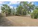 Large fenced backyard with some trees and plenty of open space at 1895 Emerson Ave, Bartow, FL 33830