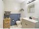 Nicely decorated bathroom with vanity, toilet, and wainscoting at 1895 Emerson Ave, Bartow, FL 33830