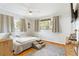 Cozy bedroom with a ceiling fan, natural lighting, and beautiful hardwood floors at 1895 Emerson Ave, Bartow, FL 33830