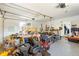 Garage interior with assorted tools, equipment, and natural light through a window at 1895 Emerson Ave, Bartow, FL 33830