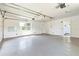 Spacious garage with ample storage space and natural light from the window, painted in neutral white at 1895 Emerson Ave, Bartow, FL 33830