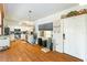 Well-lit kitchen with white cabinets, stainless steel appliances, and hardwood floors at 1895 Emerson Ave, Bartow, FL 33830