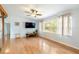 Bright living room with hardwood floors, neutral walls and a large window at 1895 Emerson Ave, Bartow, FL 33830